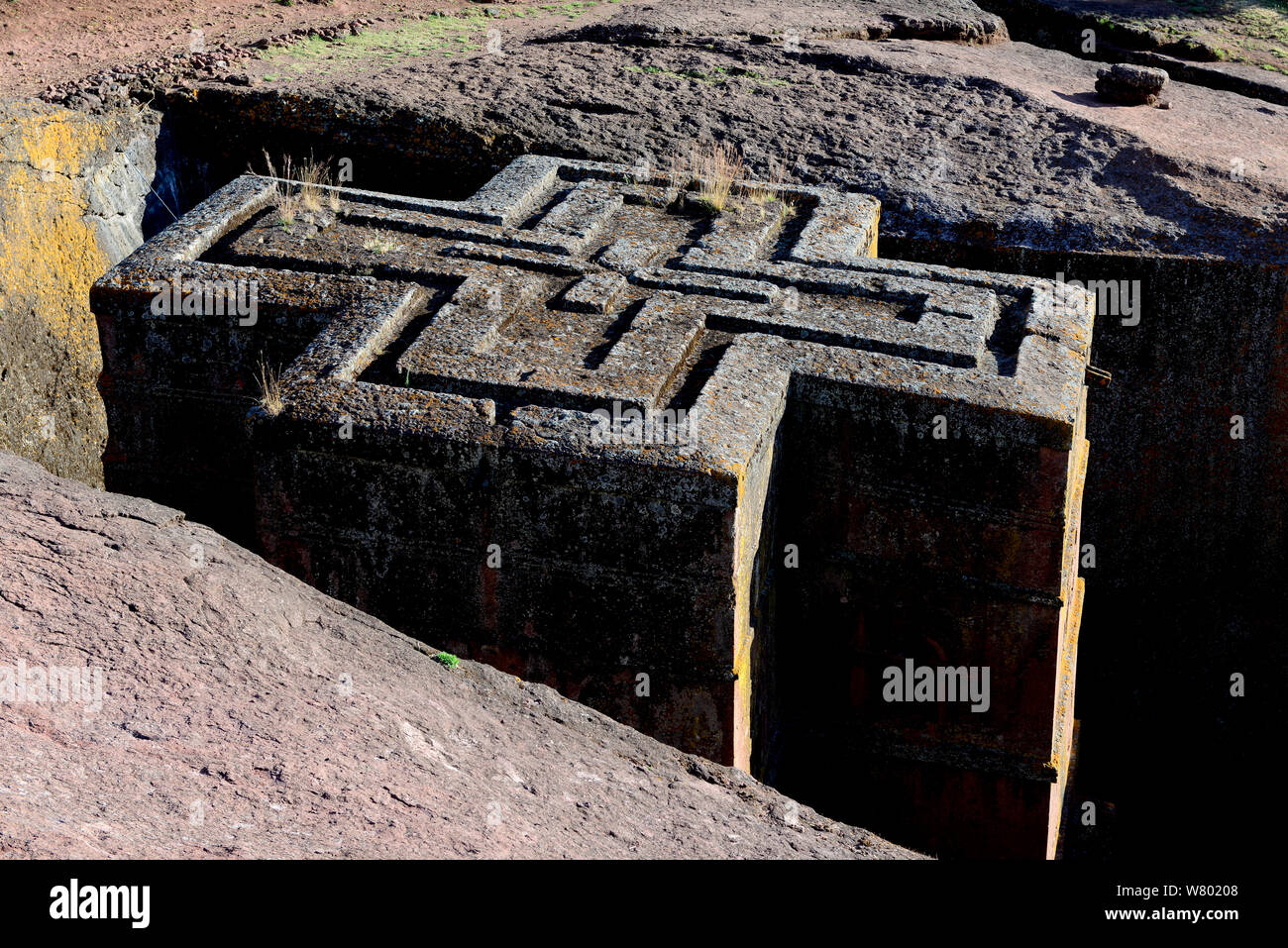 Bet Giyorgis Church, carved from solid limestone tufa rock, viewed from above to show the cross shape of the church. Lalibela. UNESCO World Heritage Site. Ethiopia, December 2014. Stock Photo