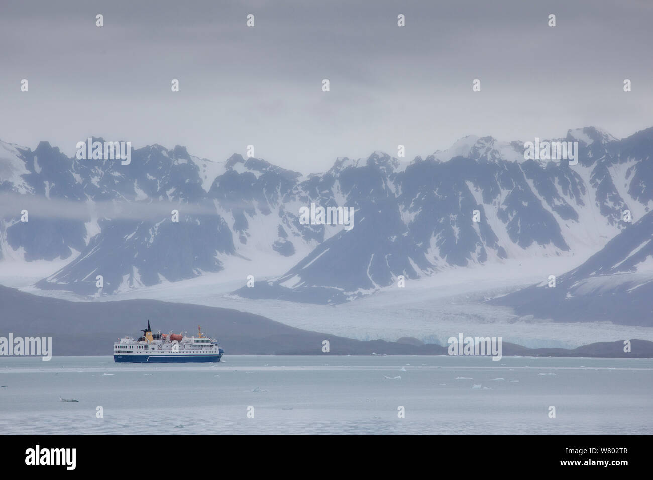 Tourist ship in glacial fjord, Spitsbergen, Norway. August. Stock Photo