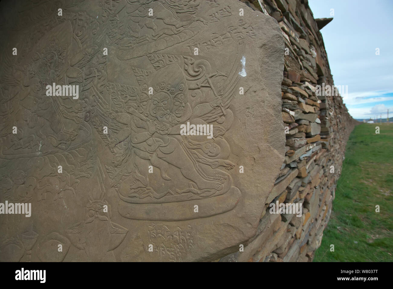 Carving of wrathful or guardian deity, Serxu, Shiqu county, Sichuan Province, Qinghai-Tibet Plateau, China. August 2010. Stock Photo