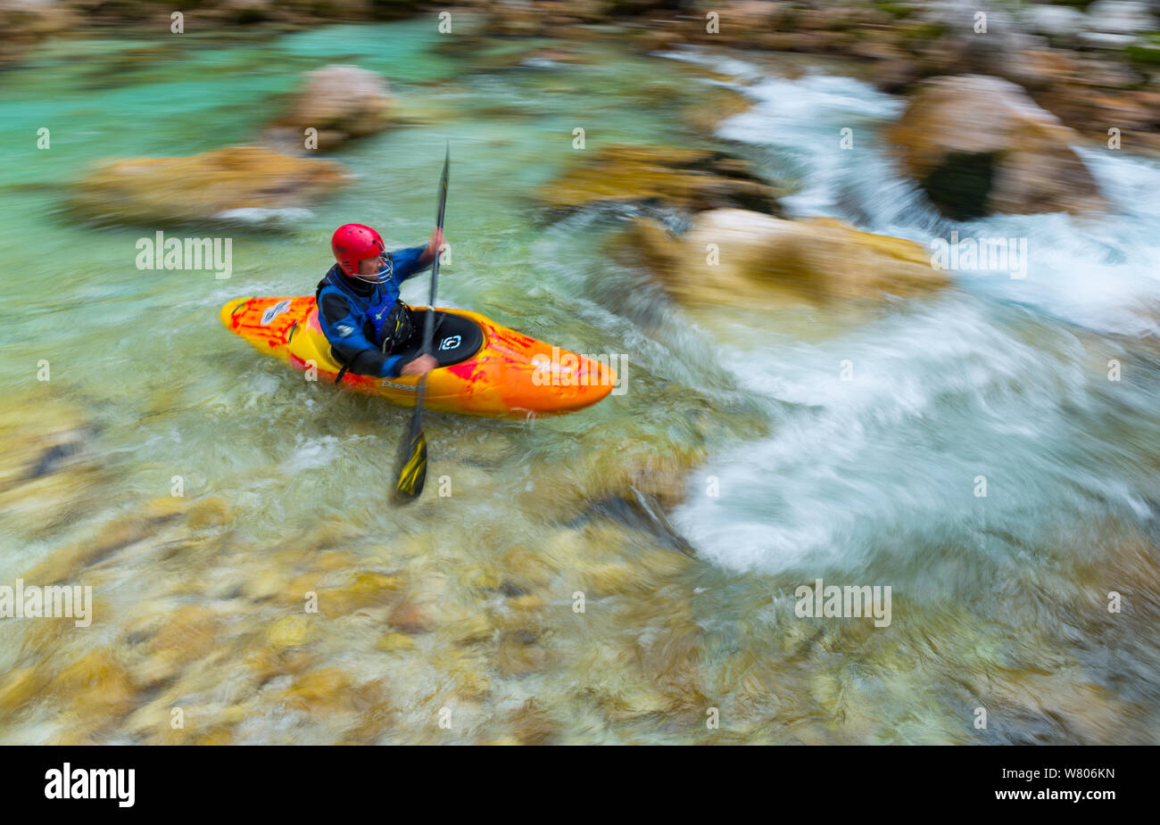 Kayak  in the Soca river, blurred motion photograph, Julian Alps, Bovec, Slovenia, October 2014. Stock Photo