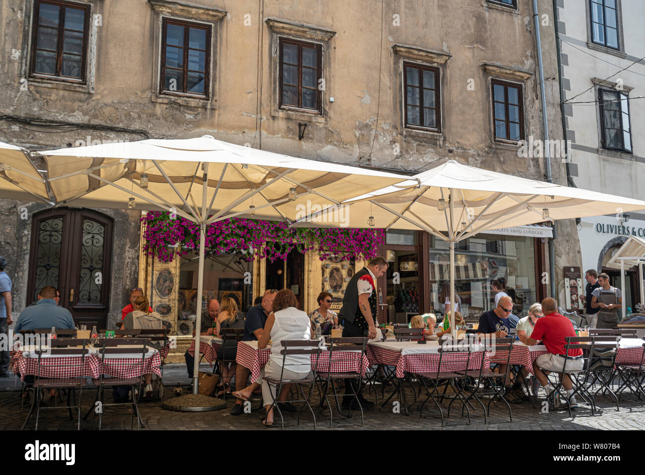 Ljubljana, Slovenia. August 3, 2019.   Outdoor restaurants on a city center street Stock Photo