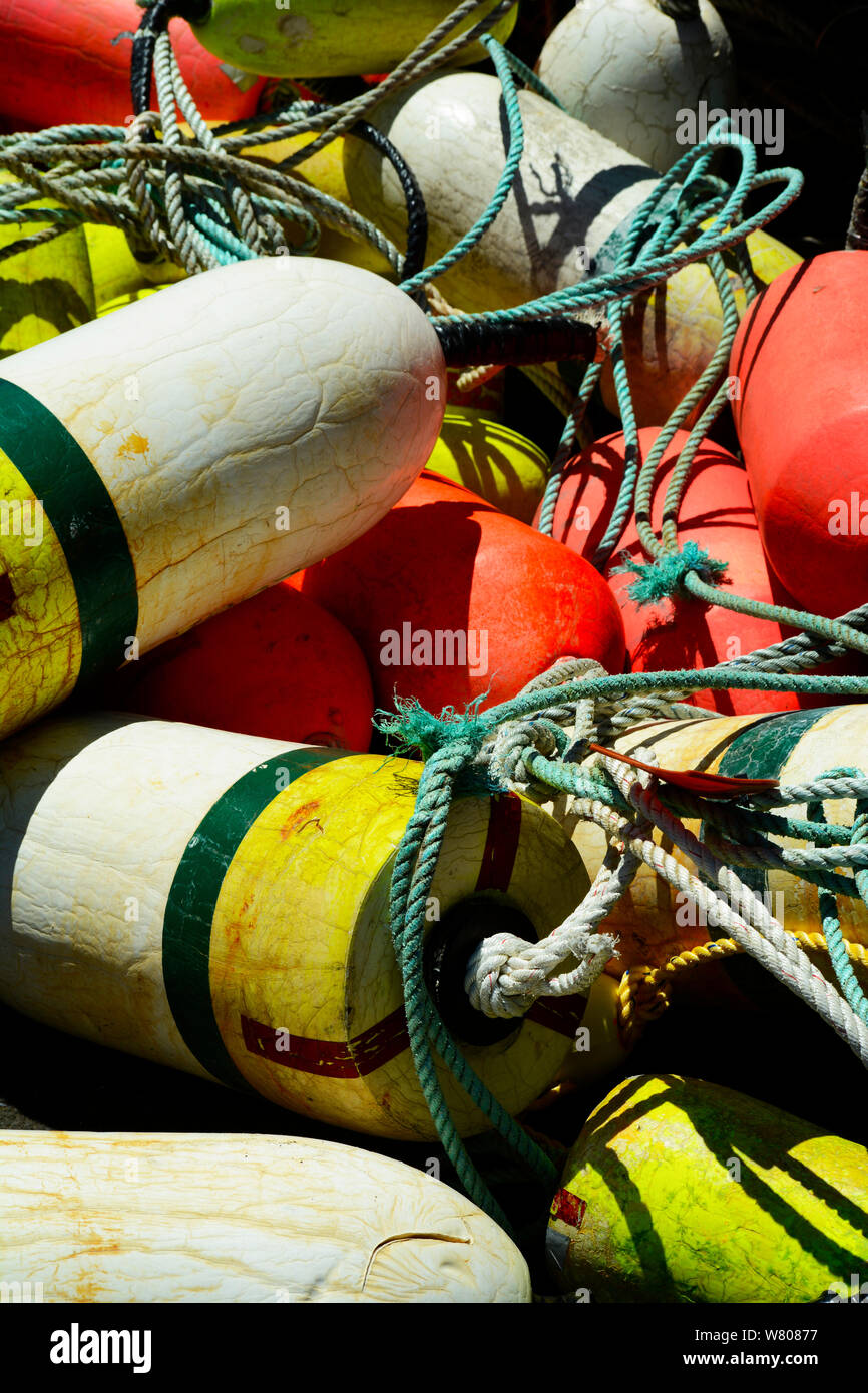Crab trap floats and buoys pilled on a commercial fishing vessel in a