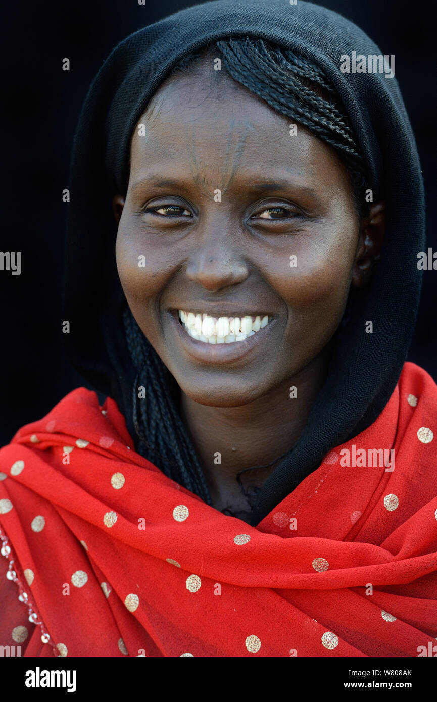 Head portrait of Afar tribe woman with facial tattoos / skin scarifications and wearing a head scarf, Malab-Dei village, Danakil depression, Afar region, Ethiopia, March 2015. Stock Photo