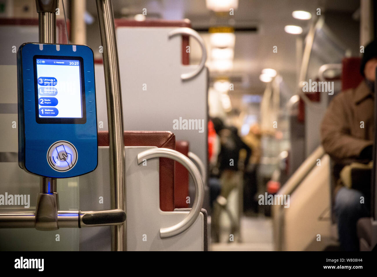 Ticket validation system in Finnish train at Helsinki Stock Photo