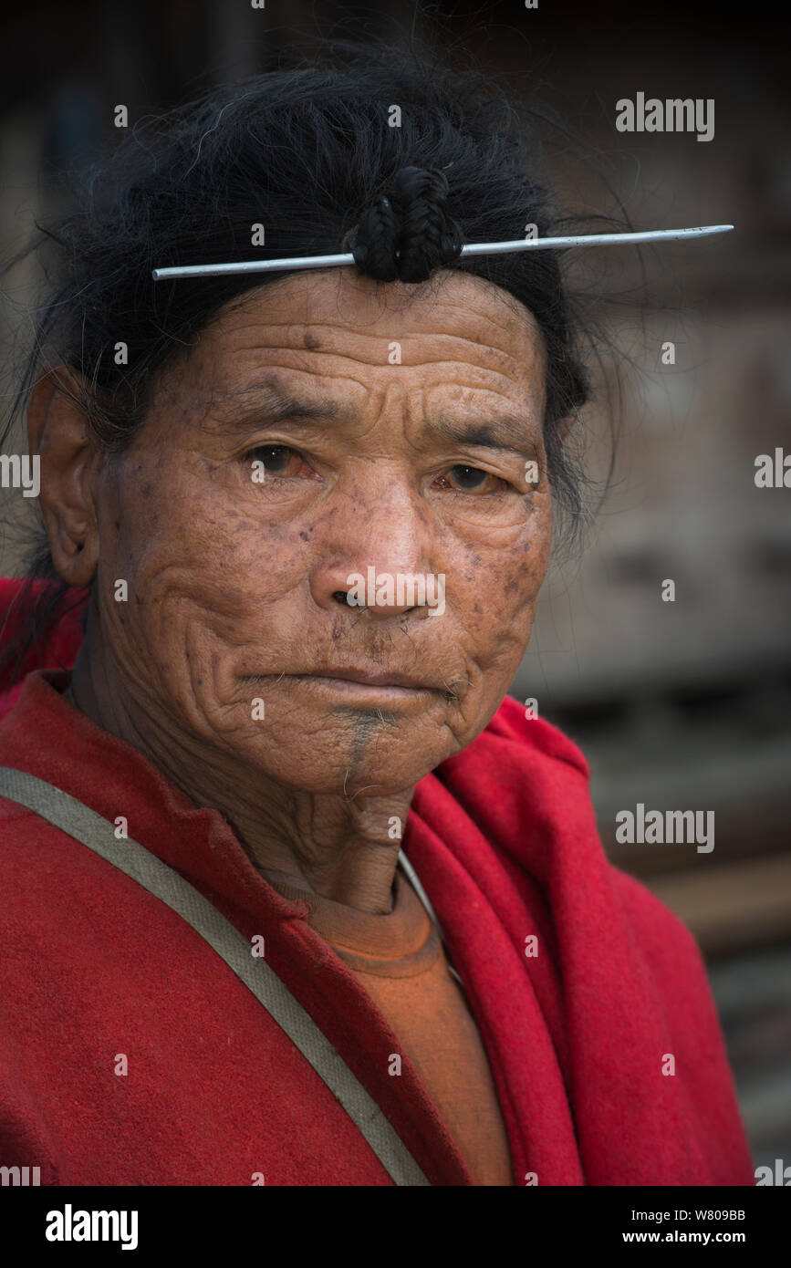 Apatani man with traditional hair knot fixed by a skewer or Piidin Khotu. Apatani Tribe, Ziro Valley, Himalayan Foothills, Arunachal Pradesh.North East India, November 2014. Stock Photo