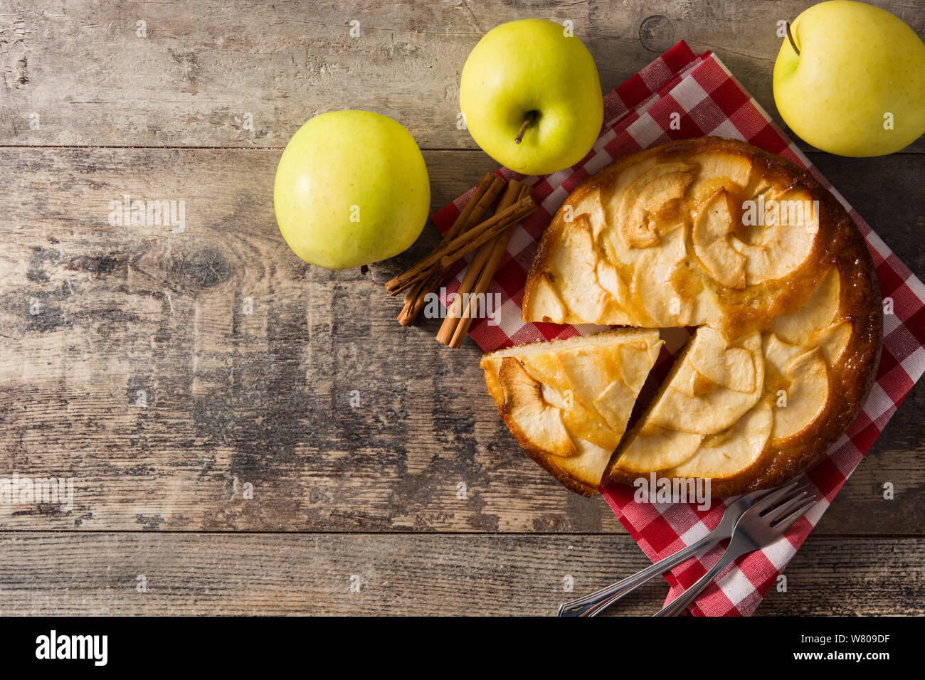 Homemade slice apple pie on wooden table.Top view. Copyspace Stock Photo