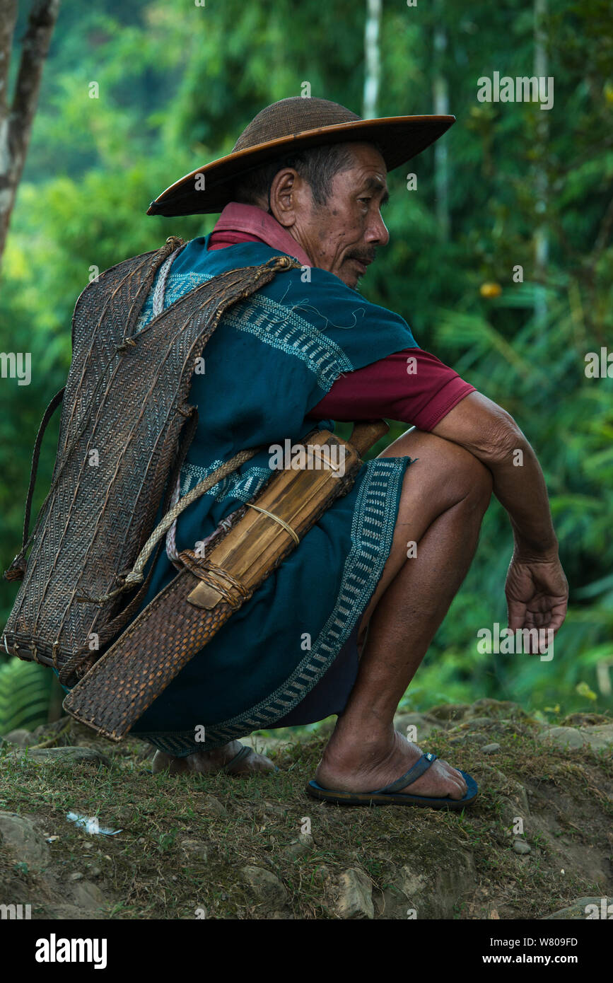 Adi Gallong man wearing traditional cane hat. Adi Gallong Tribe. Arunachal Pradesh, North East India, October 2014. Stock Photo