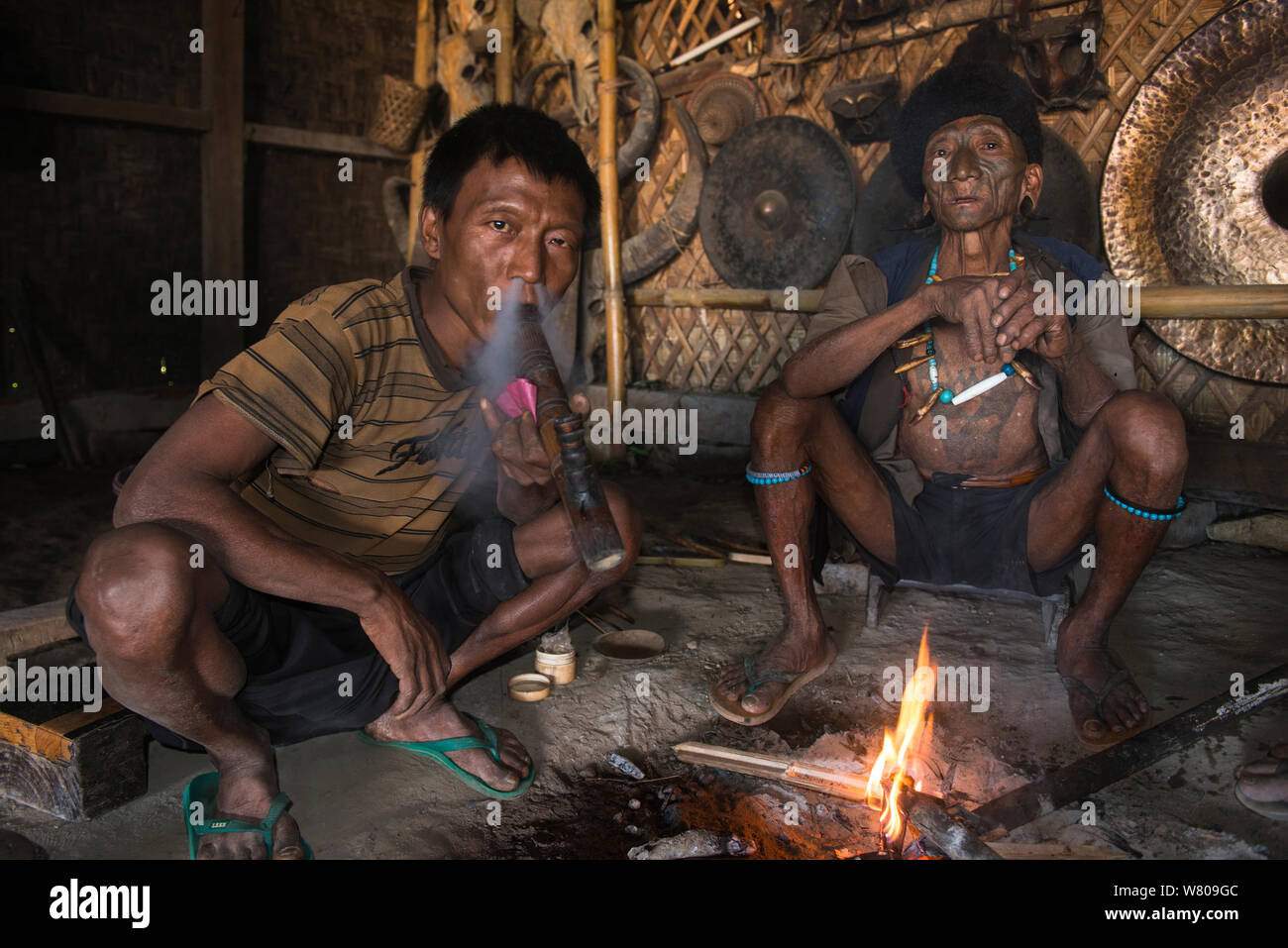 Konyak Naga opium smokers. Mon district. Nagaland,  North East India, October 2014. Stock Photo