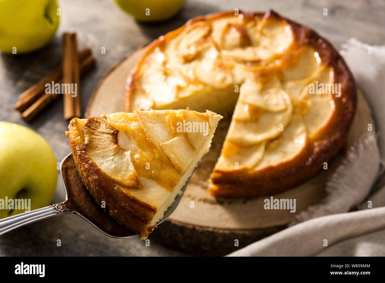 Homemade slice apple pie on wooden table. Stock Photo