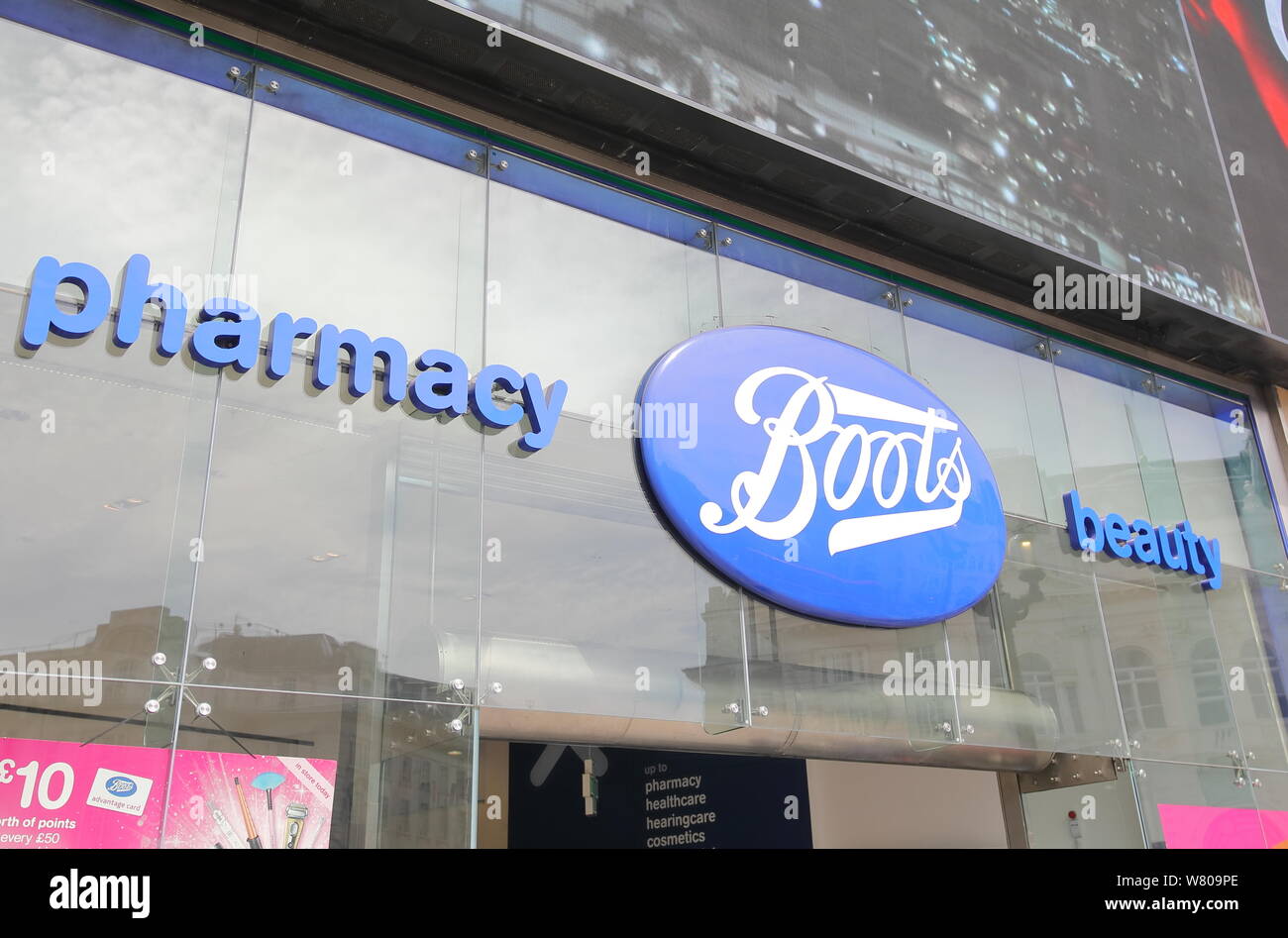 Boots pharmacy sign London UK Stock Photo Alamy