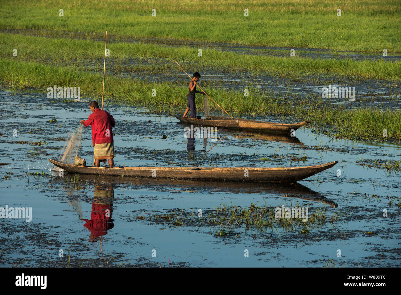 Fisherman in canoe, Mising Tribe, Majuli Island, Brahmaputra River