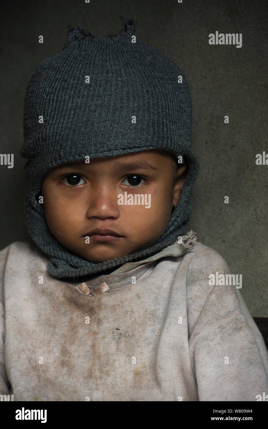 Khasi Child wearing woolly hat, Nongriat, Khasi Hills. Meghalaya, North East India, October 2014. Stock Photo