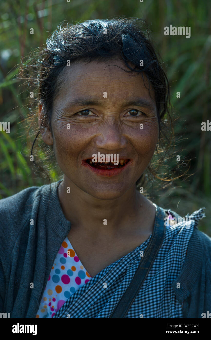 Khasi woman chewing Betel nut, a mild stimulant which leaves red staining on the teeth, Barabazar market, Shillong, Meghalaya, North East India. Stock Photo