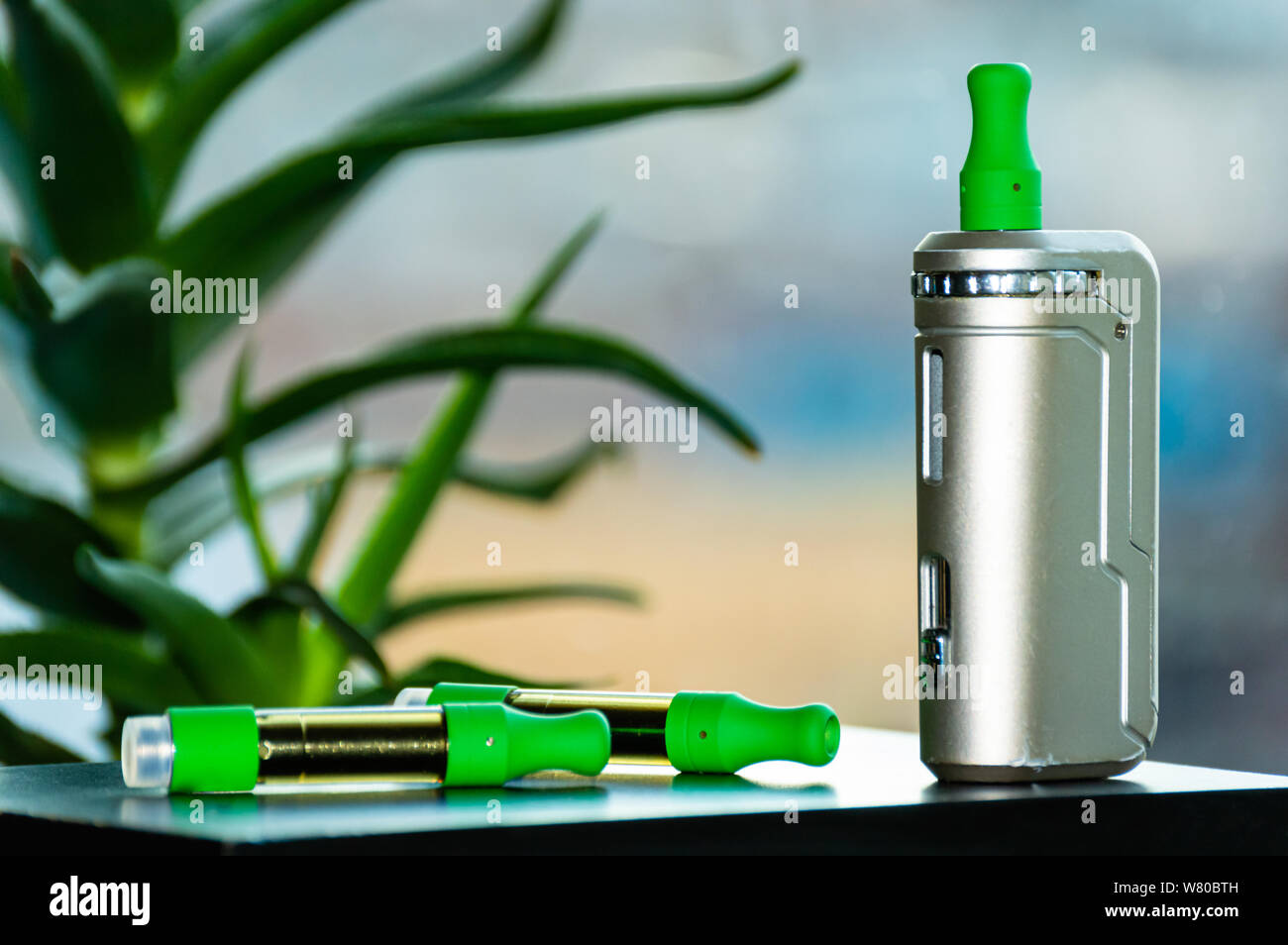 A vape kit including THC CBD cannabis oil cartridge and personal rechargeable vaping device. Stock Photo