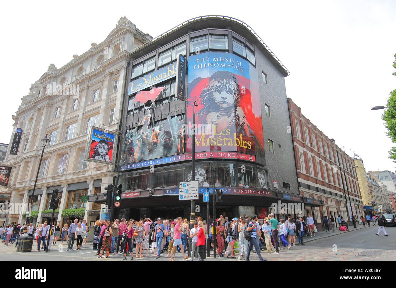 People visit Queens theatre Soho London UK Stock Photo
