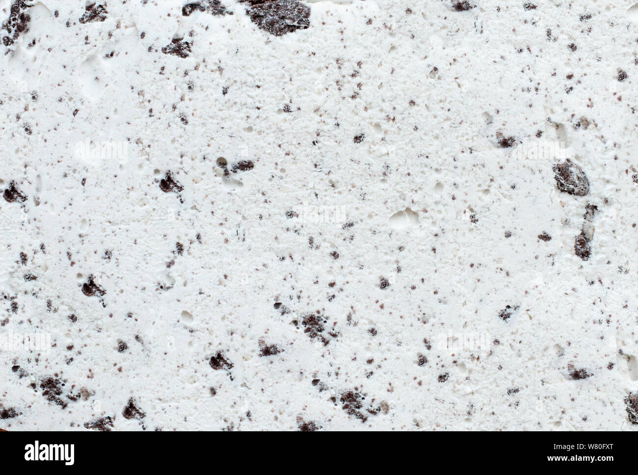 Flatlay view of cookies and cream ice cream background texture. Stock Photo