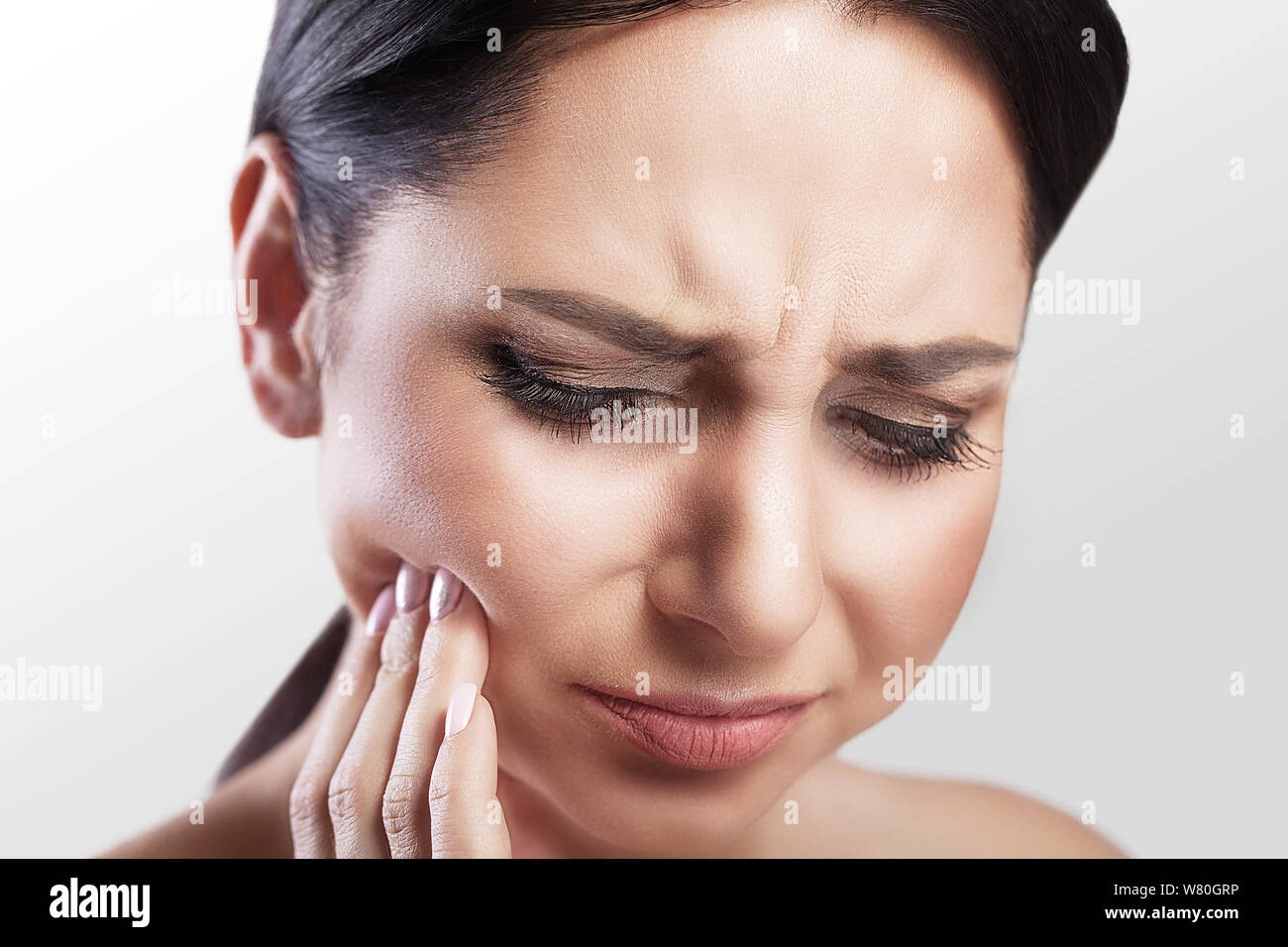pain. Teeth Problem. Woman Feeling Tooth Pain. Closeup Of A Beautiful