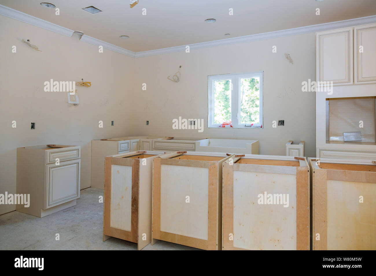 Custom Kitchen Cabinets In Various Stages Of Installation Base For