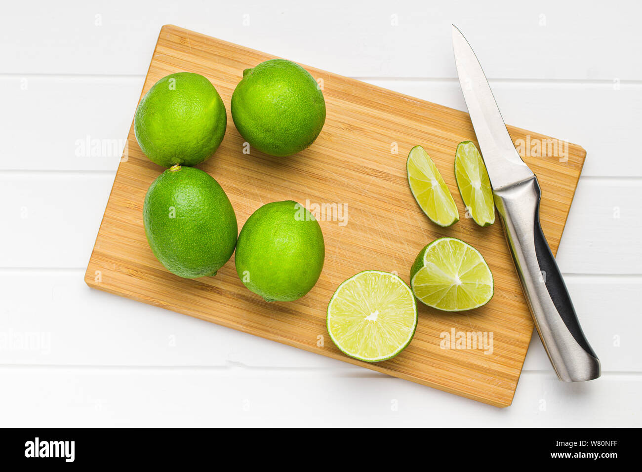 The green sliced lime on cutting board. Stock Photo