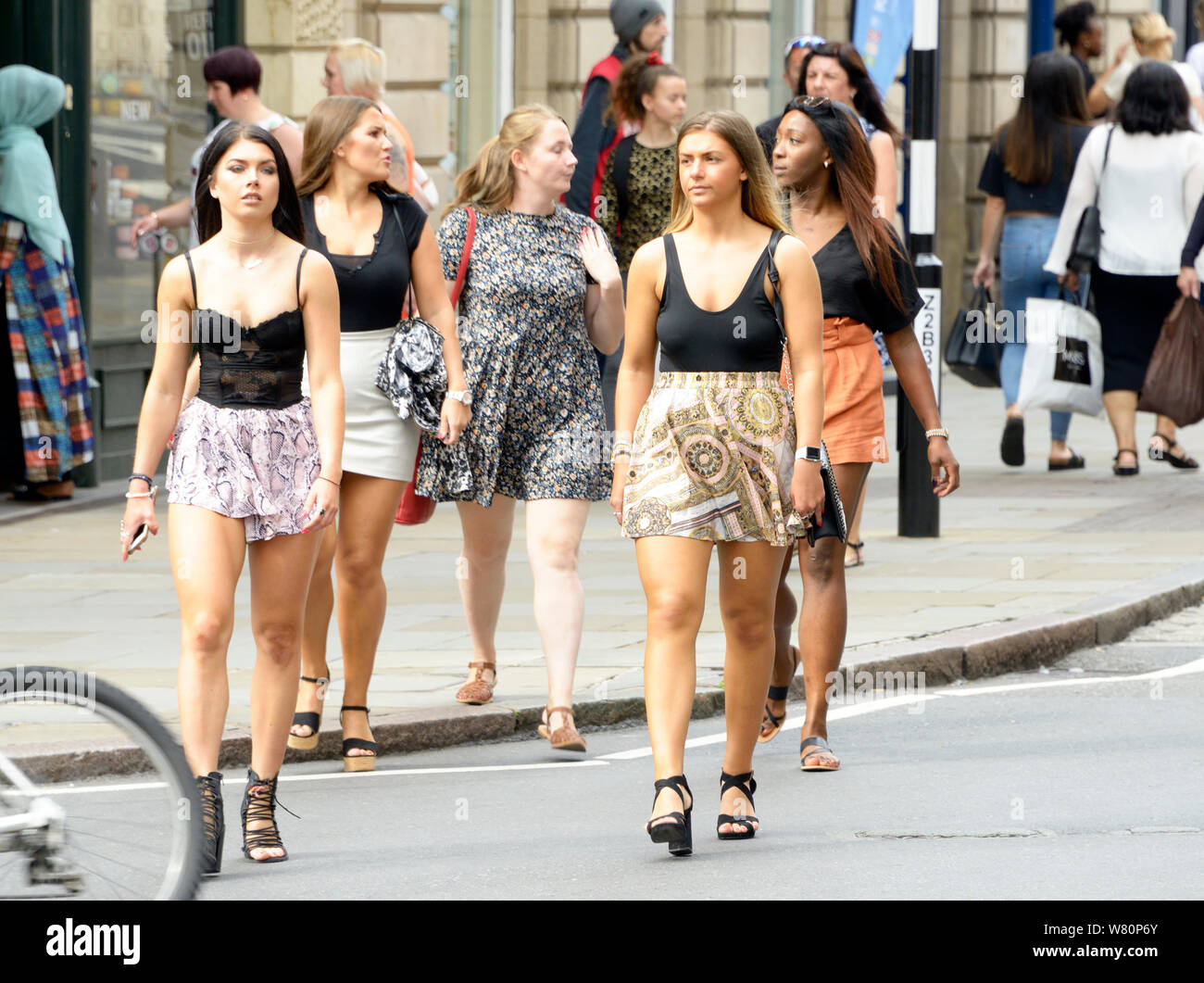 Group of summery looking girls out shopping. Stock Photo