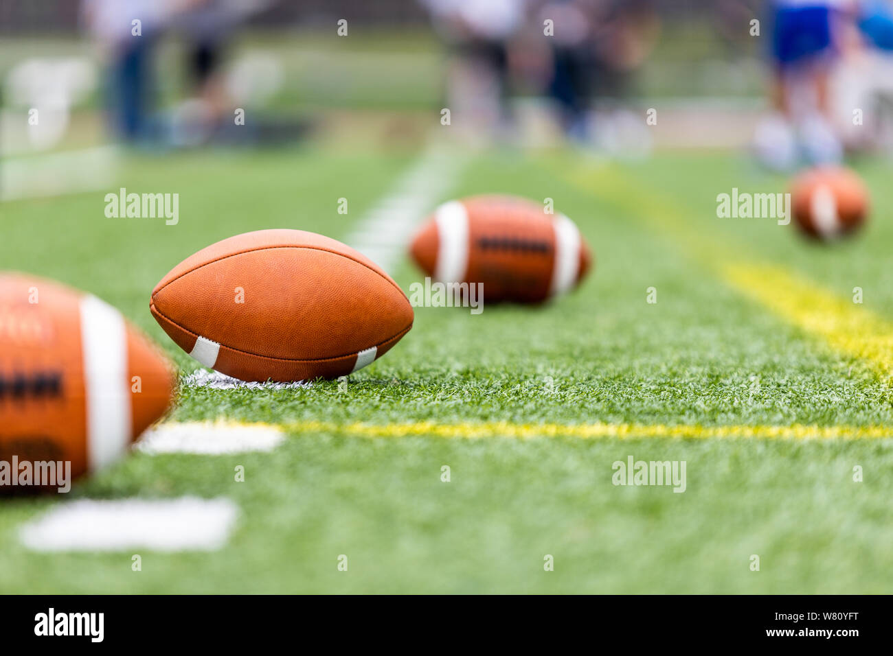 Multiple football balls are laying on a training field Stock Photo Alamy
