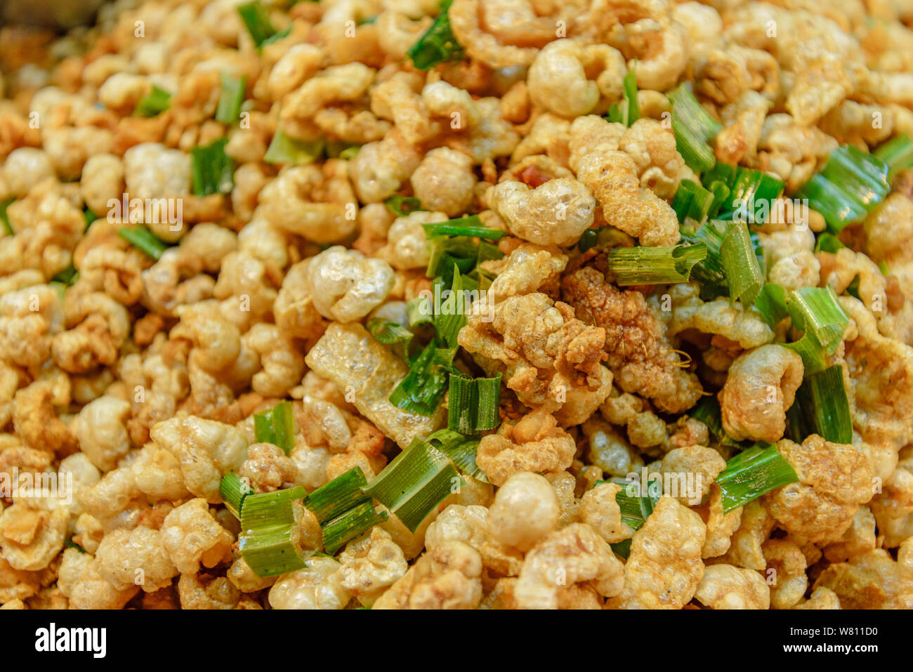 Pile of deep fried or bake pork snack, pork rind, pork scratching or
