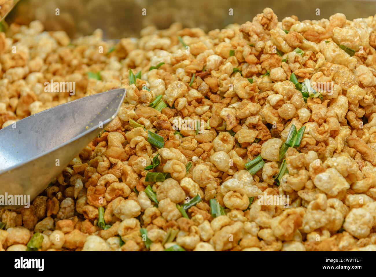 Pile of deep fried or bake pork snack, pork rind, pork scratching or
