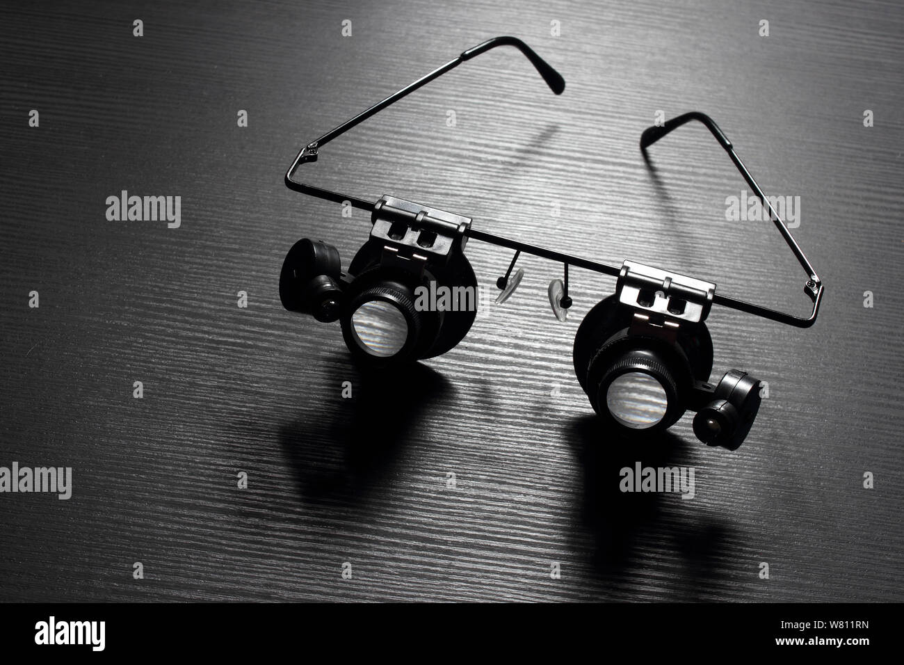 Magnifying Glasses on Wooden Background Stock Photo