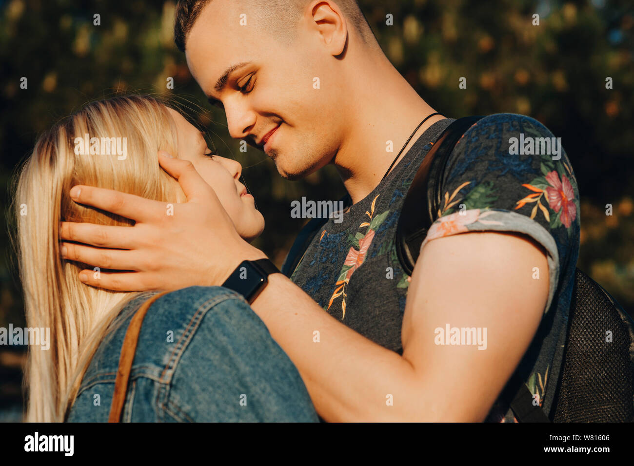 https://c8.alamy.com/comp/W81606/beautiful-young-men-holding-his-amazing-girlfriends-face-close-looking-at-her-with-love-smiling-while-she-is-looking-at-him-while-traveling-around-the-W81606.jpg