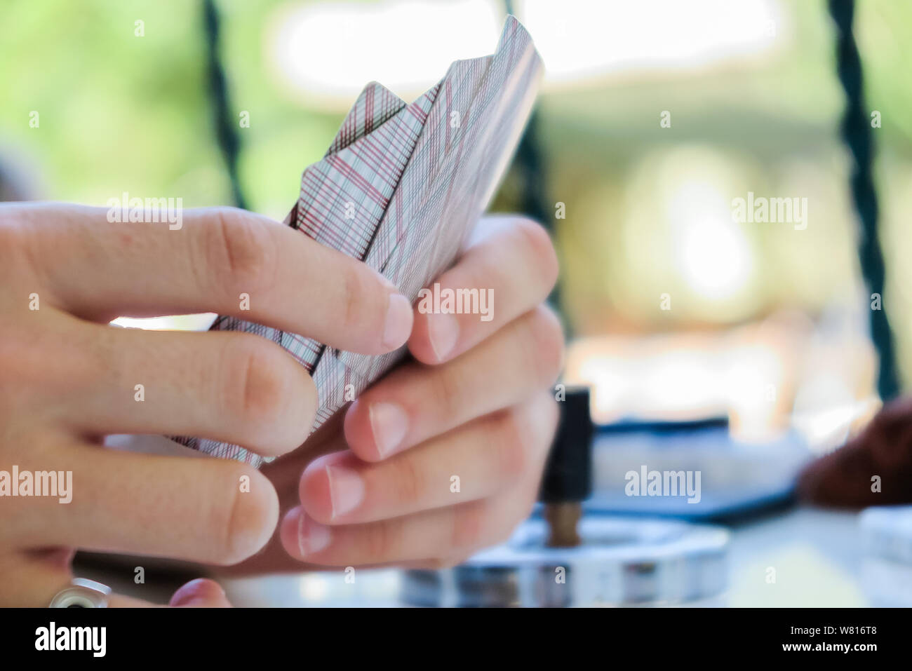 Playing cards in men's hands, gambling, playing cards. Stock Photo