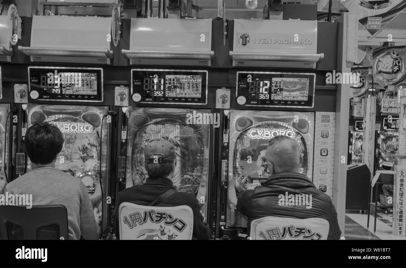 Seeing Tokyo Arcades in black and white adds the retro element to this popular Japanese entertainment activity. It makes it timeless, just like it is... Stock Photo