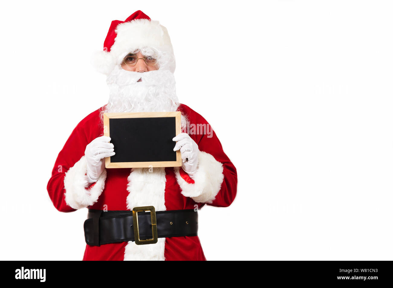 Santa Claus with a blackboard and copy space Stock Photo - Alamy