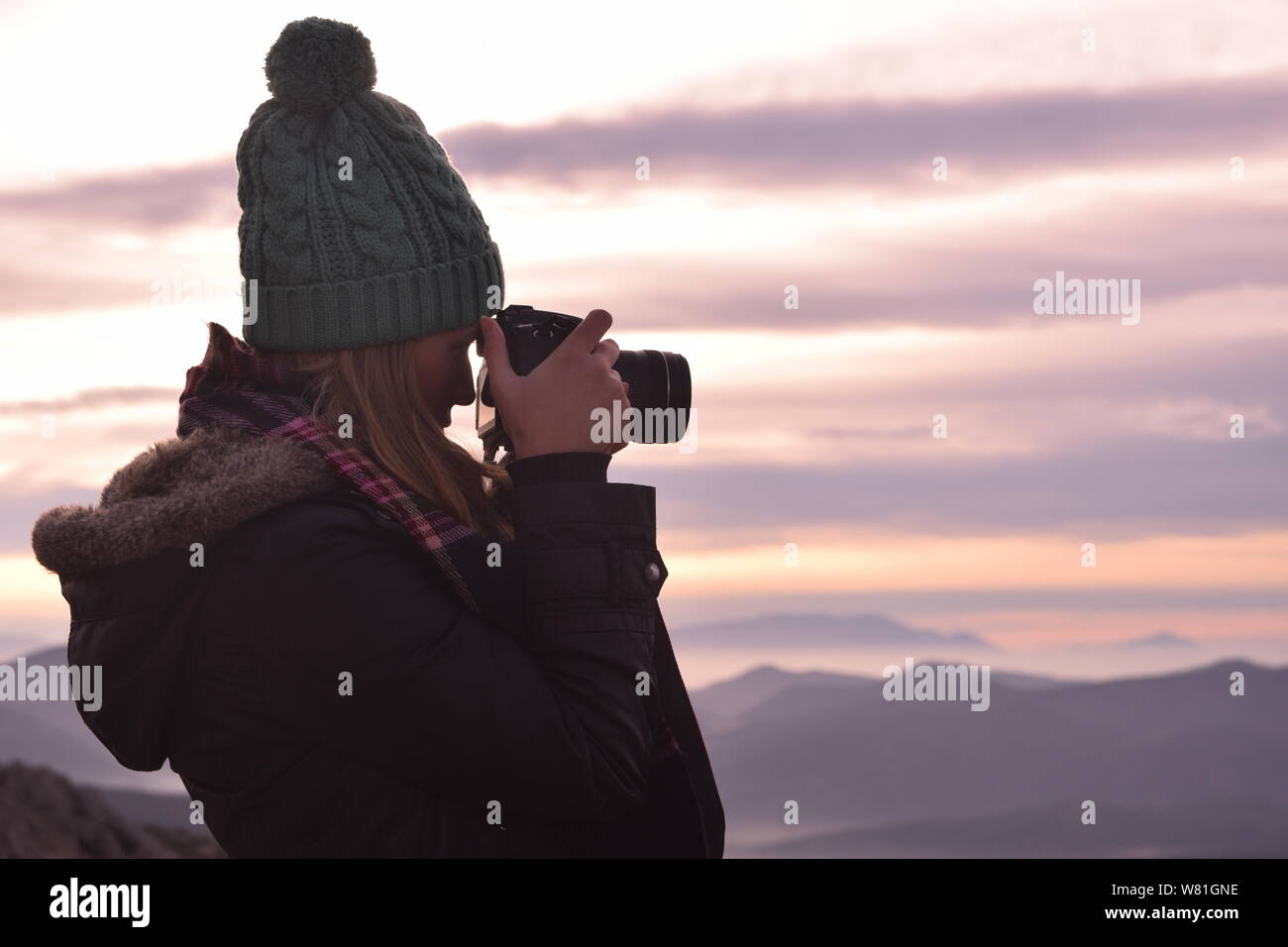 Beautiful young female photographer shooting with professional camera in Outdoor.  Photo taken on 13th Nowember 2016, Burdur, Turkey Stock Photo