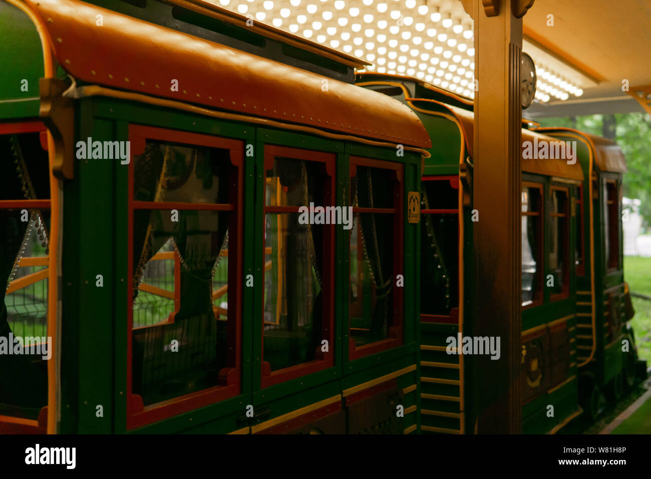 miniature railway carriages in retro style at the station of the narrow