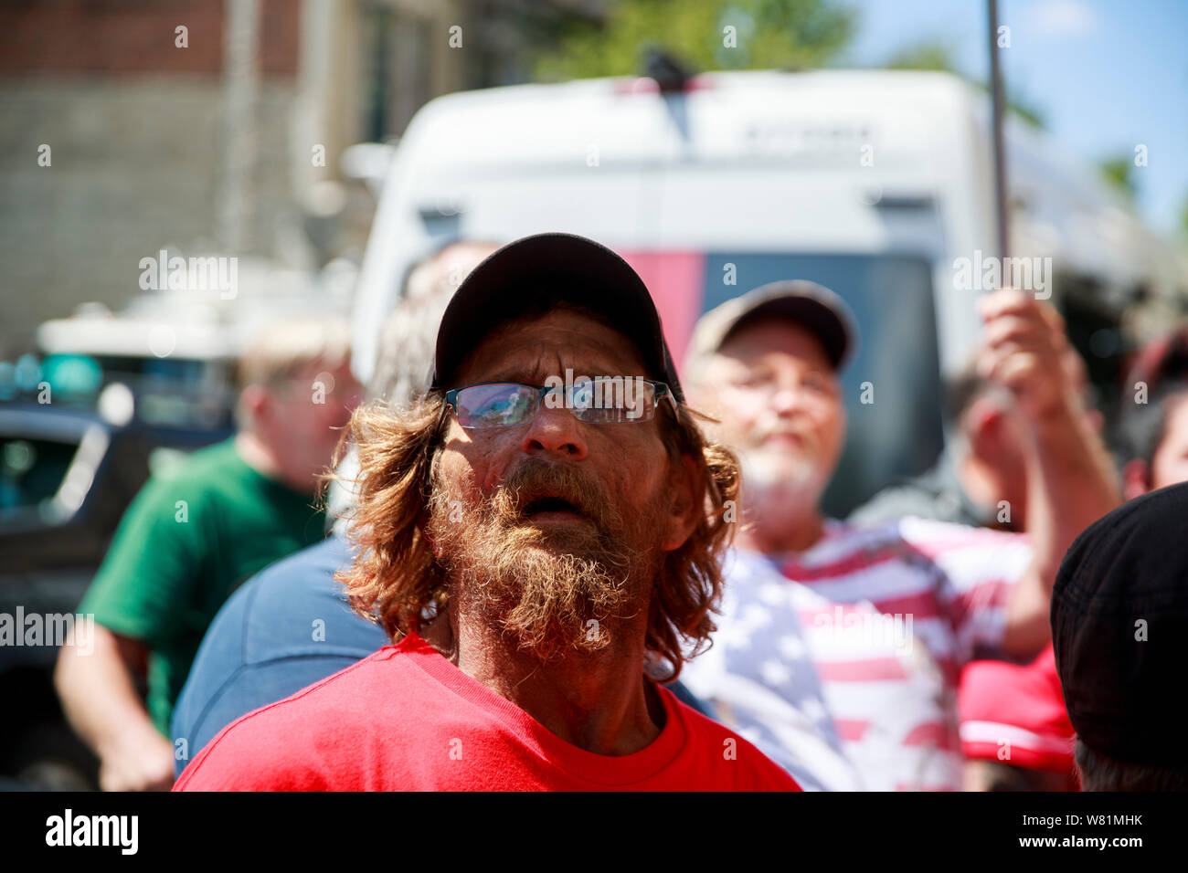 Trump supporters arguing with protesters on on 5th Street at the site of Sunday morning's mass shooting that left 9 dead, and 27 wounded, Wednesday, August 7, 2019 in Dayton, Ohio. Trump visited a nearby hospital but did not visit the site of the shooting before flying to El Paso, Texas, which was also the site of a mass shooting. Stock Photo