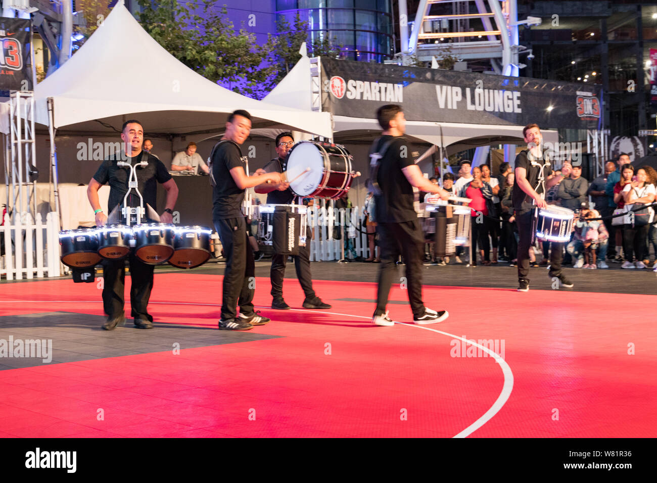 LOS ANGELES, CA, USA - AUGUST 2, 2019: Downtown Dark Nights Event at L.A. LIVE in the Xbox Plaza. A drumline live performance. Stock Photo