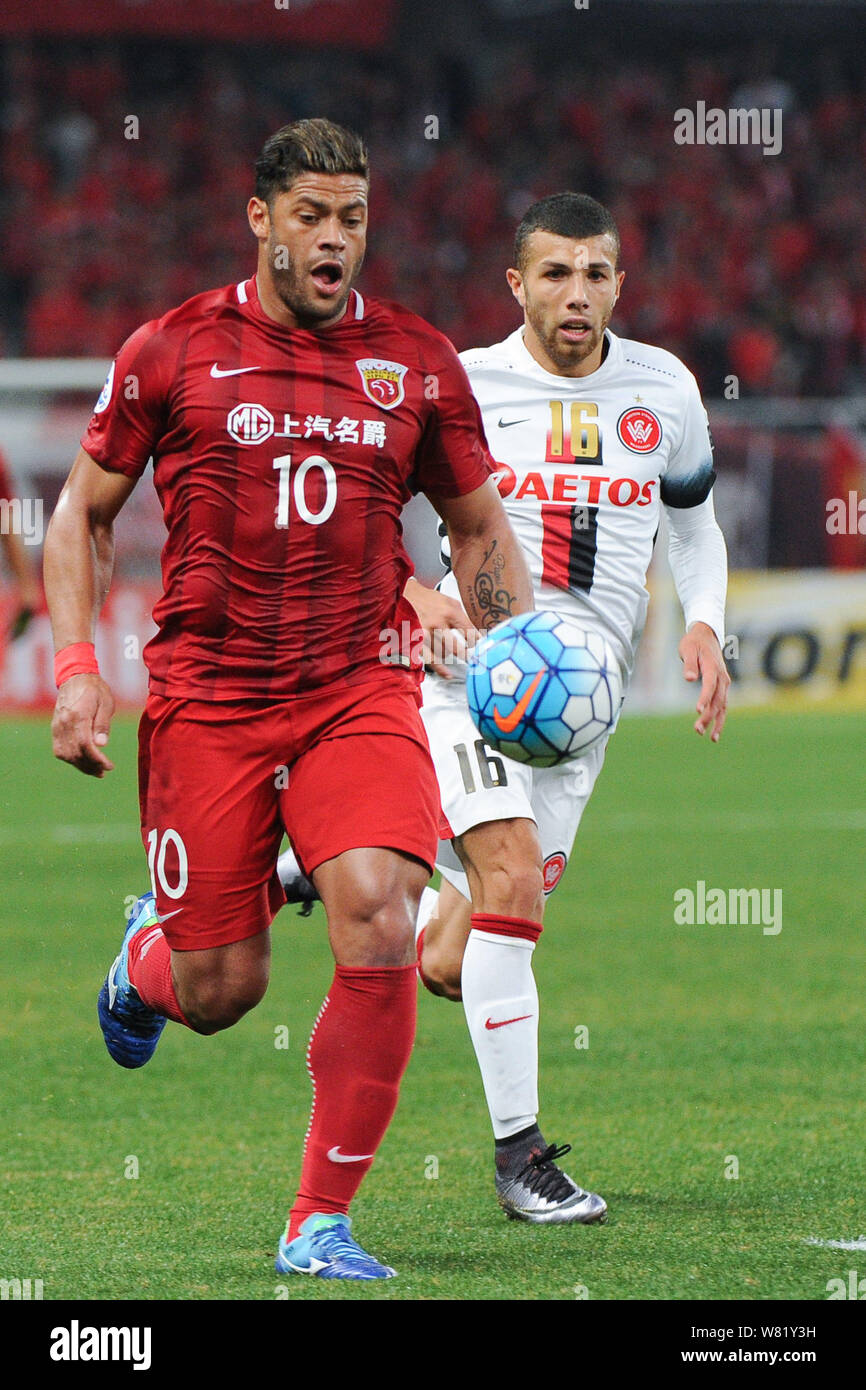 Brazilian football star Givanildo Vieira de Sousa, left, better known as Hulk, of China's Shanghai SIPG, challenges Jaushua Sotirio of Australia's Wes Stock Photo