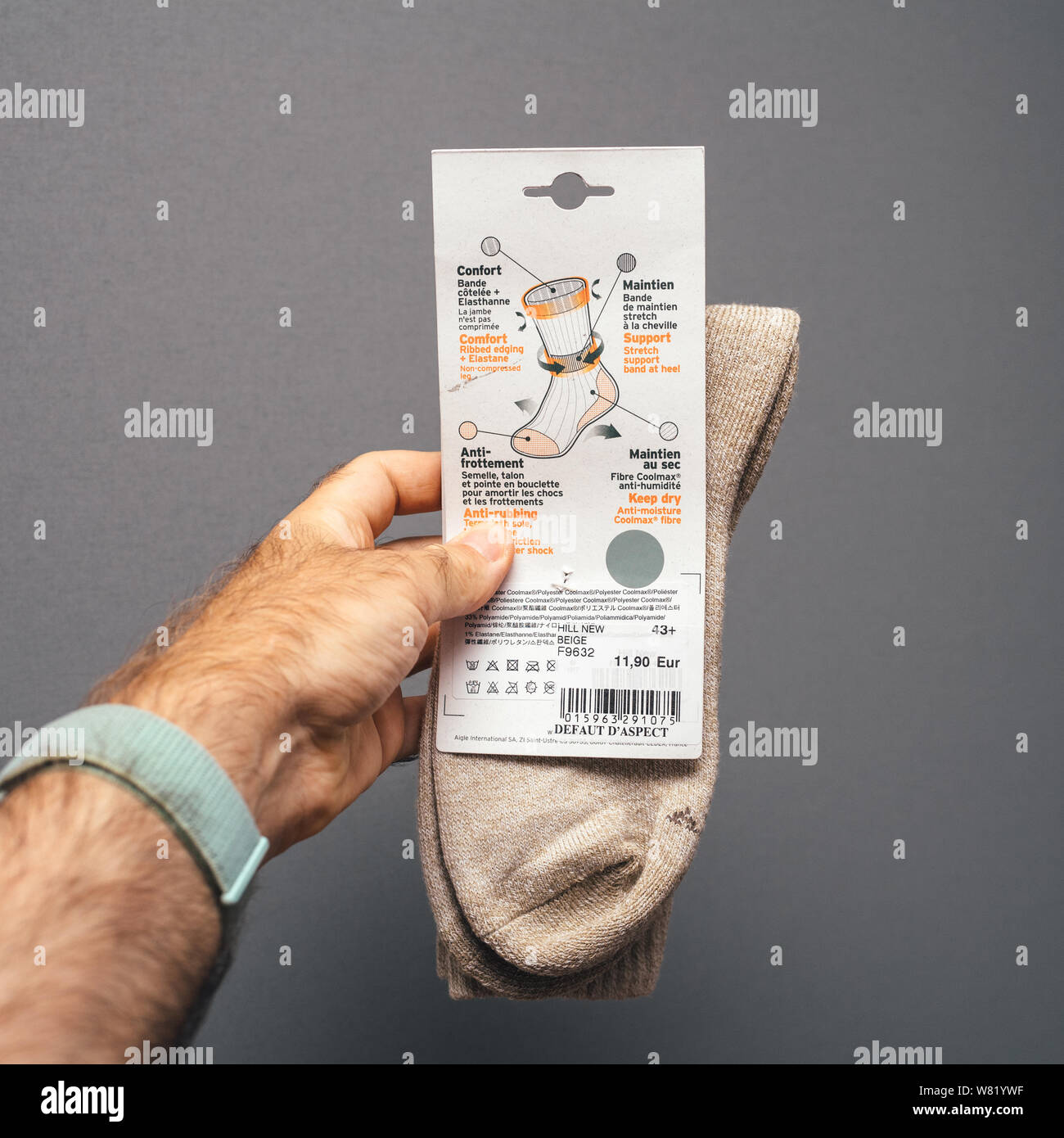 Paris, France - Sep 8, 2018: Man hand holding wool socks for hiking  manufactured by French company