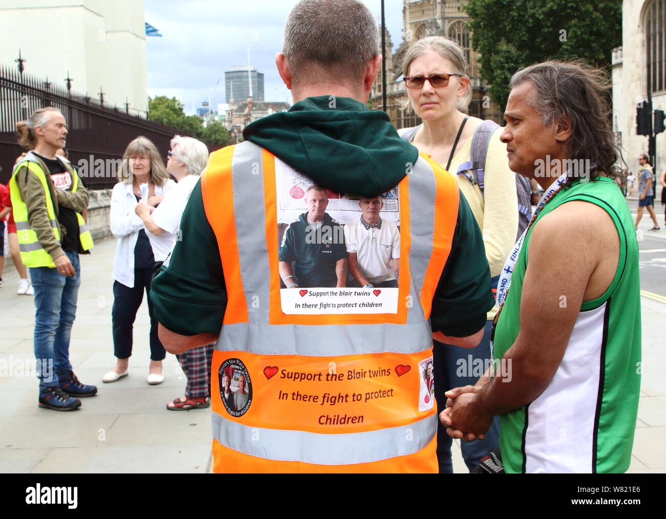 A protester wears hi vis jacket as he supports the action in the fight to protect children during the demonstrationBeech Holme Warriors group Protest outside Parliament and Downing Street, Fighting for the rights of children not to live in fear of abuse and for Survivors to get justice. Stock Photo