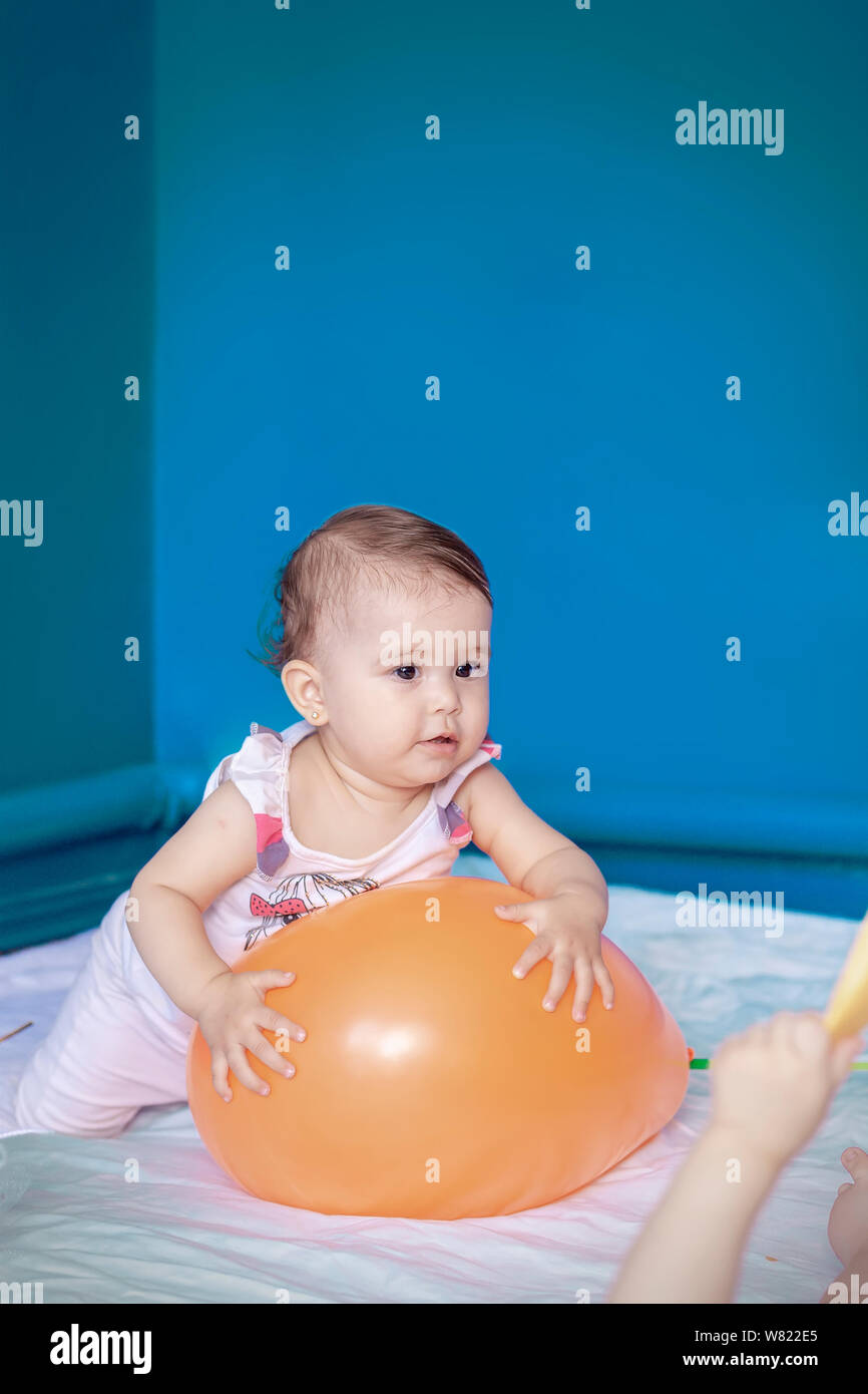 Baby Playing With A Balloon Baby Girl Doing Her Daily Activities Little Cute Girl Learning To Stand Up And Walk Copy Space Stock Photo Alamy