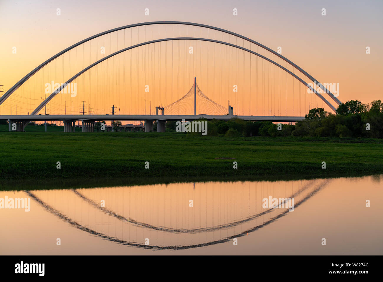Dallas bridge reflection on the flooded Trinity River near downtown Dallas, Texas. Stock Photo