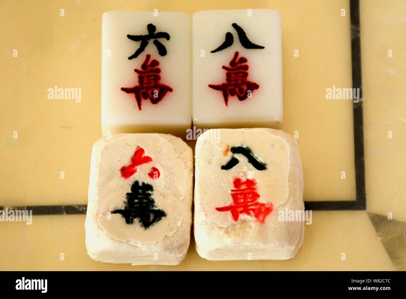 Stuffed glutinous rice dumplings, also known as Yuanxiao or Tangyaun, in  the shape of Mahjong tiles for the Lantern Festival are pictured in  Liaocheng Stock Photo - Alamy