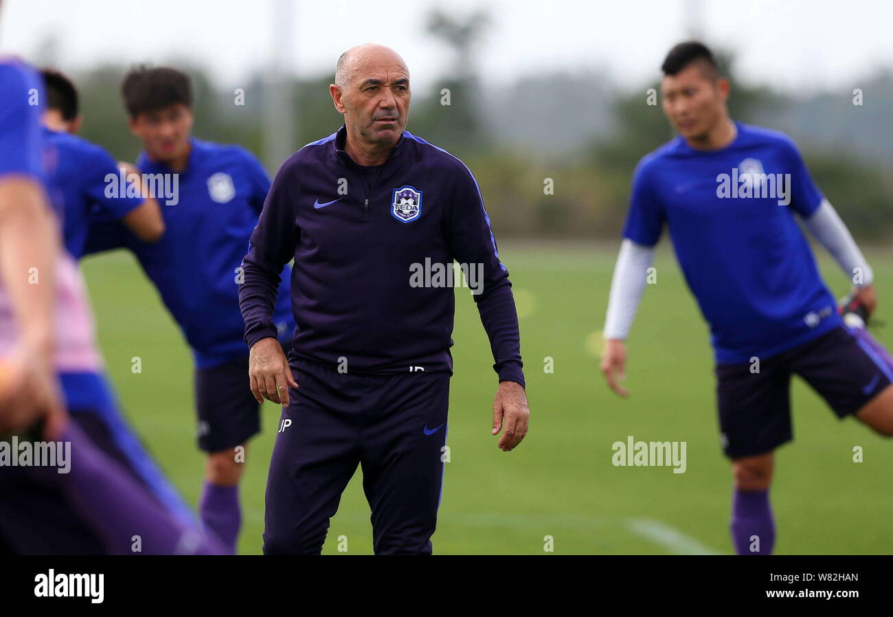 Head coach Jaime Pacheco and other players of Tianjin TEDA F.C. take part in a training session in Okinawa, Japan, 20 February 2017. Stock Photo