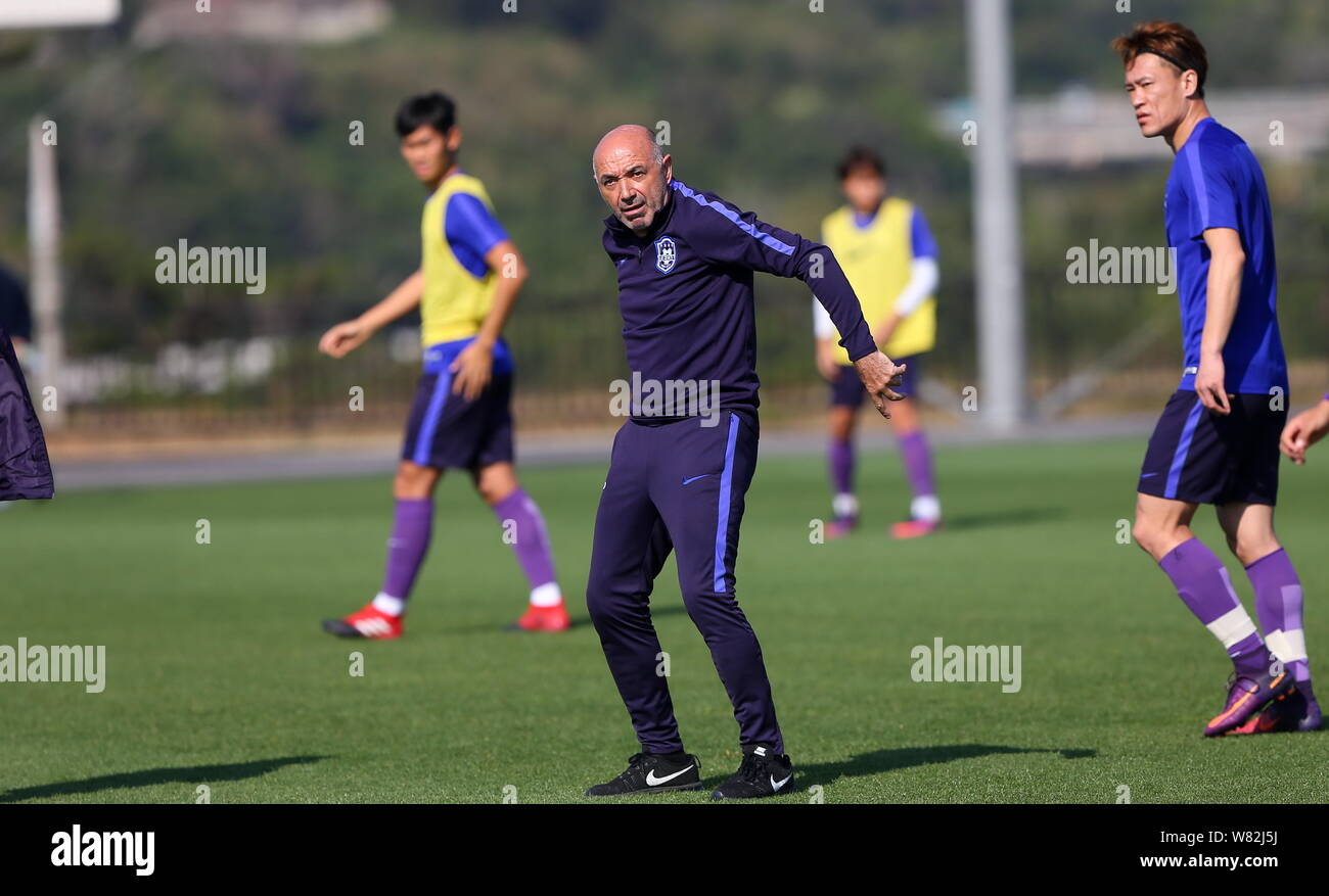 Head coach Jaime Pacheco of Tianjin TEDA F.C., center, take part in a training session in Okinawa, Japan, 16 February 2017. Stock Photo