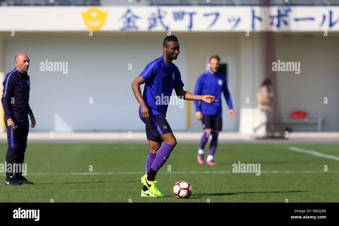 Nigerian football player John Obi Mikel, center, and other players of Tianjin TEDA F.C. take part in a training session in Okinawa, Japan, 16 February Stock Photo