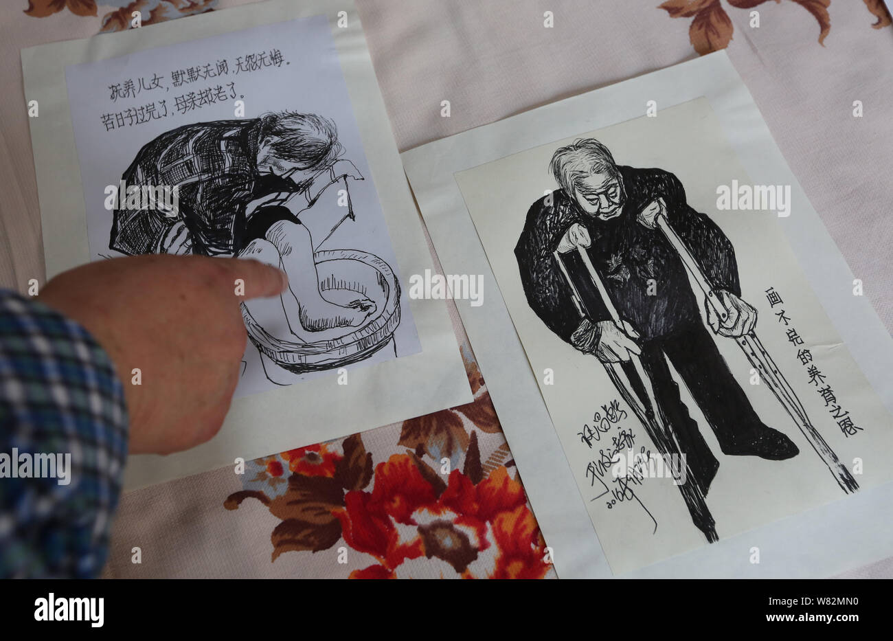 Li Fu Artist Chinese artist Li Fuchang shows sketches created by him to record the ...