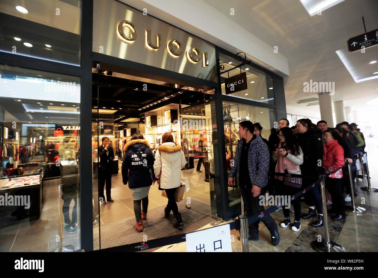 Chinese customers queue up in front of a store of Gucci due to a discount  at a Shanghai outlets in Shanghai, China, 12 February 2017. Chinese custom  Stock Photo - Alamy