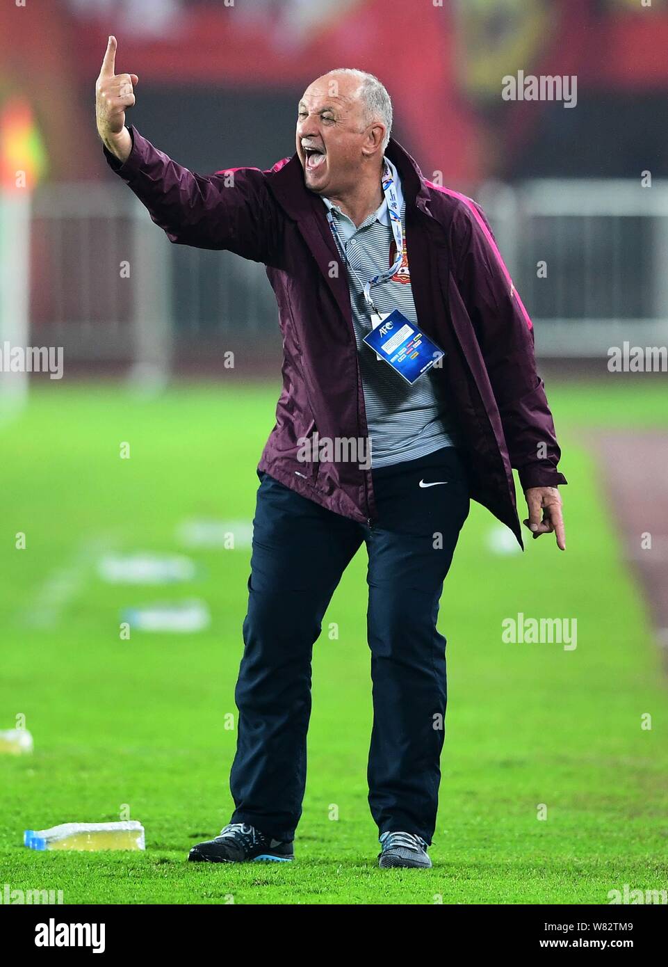 Head coach Luiz Felipe Scolari of China's Guangzhou Evergrande Taobao F.C. reacts as he watches his players competing against Hong Kong's Eastern SC i Stock Photo