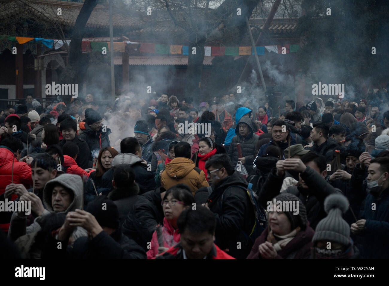 Chinese worshippers burn incense sticks to pray for good luck on the ...