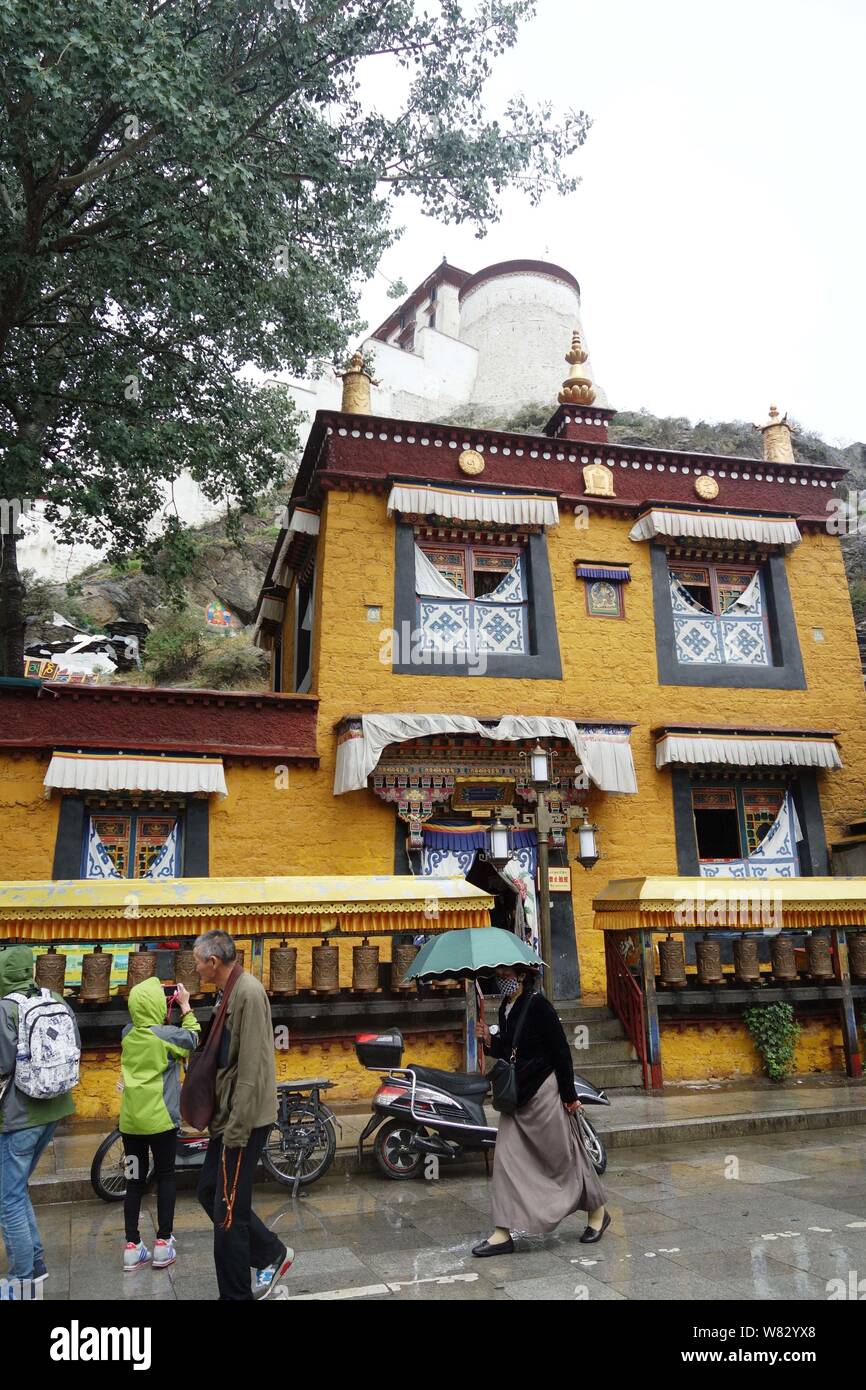 FILETourist walk past a modern public toilet in the scenic area of